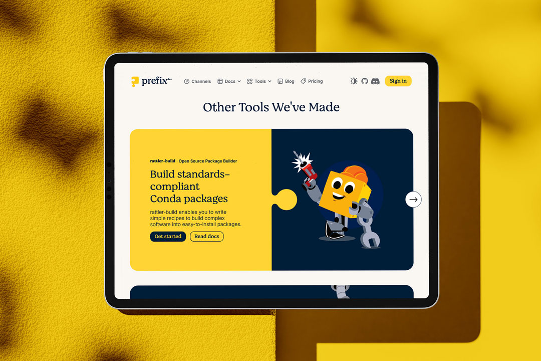 prefix.dev-Website auf einem iPad mit heller Oberfläche und markanter Puzzle-Bildsprache.