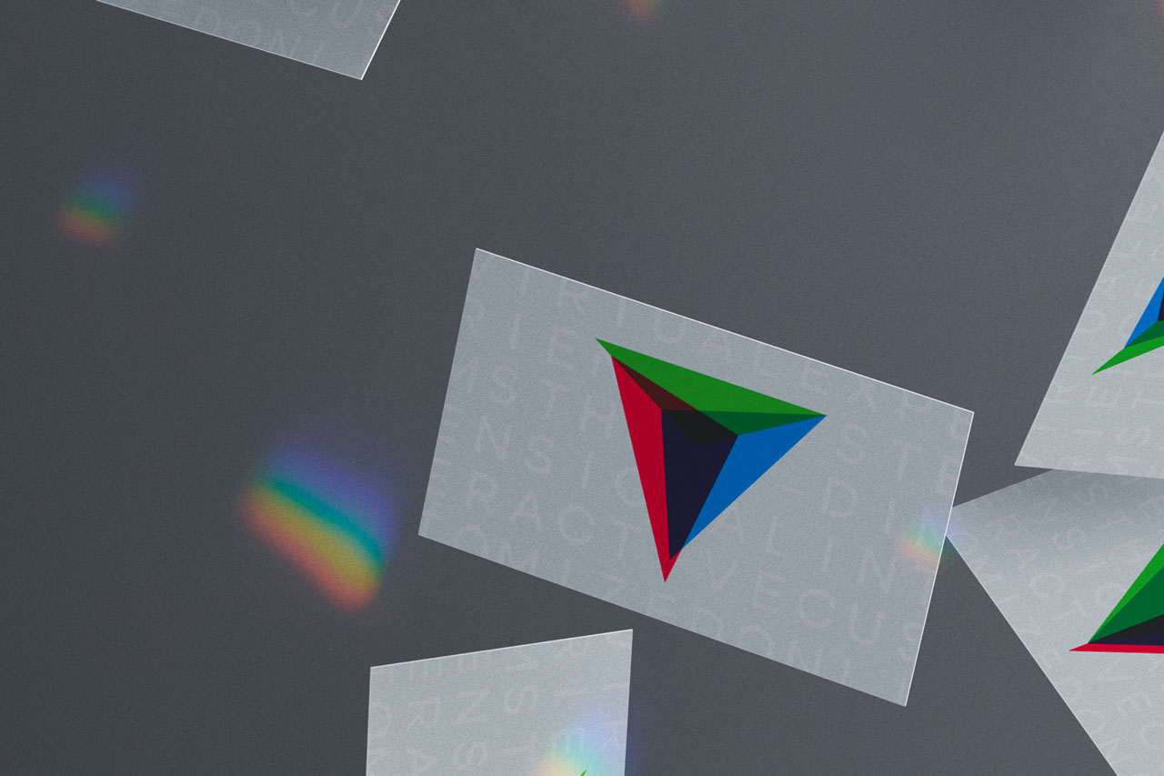 Visitenkarten von VESTICO mit verschiedenen Logo-Varianten fallend fotografiert.